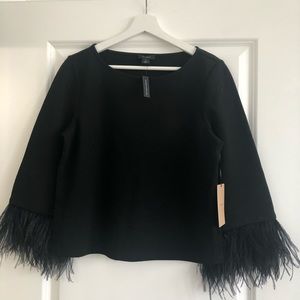Black top with feather detail